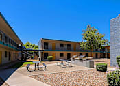 Thumbnail 28 of 30 - Courtyard with picnic tables at The Link Apartments, Mesa, 85201