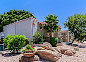 Thumbnail 92 of 94 - A house with a red roof and a palm tree in front.