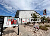 Thumbnail 15 of 20 - A sign for a fire station is displayed in front of a building.