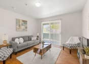 Thumbnail 5 of 15 - a living room with a couch coffee table and chairs