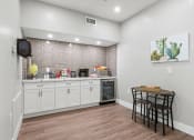 Thumbnail 12 of 15 - our apartments have a kitchen with a breakfast bar