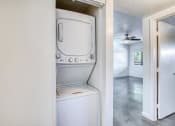 Thumbnail 7 of 10 - a washer and dryer in a laundry room