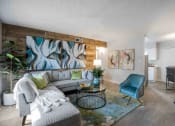 Thumbnail 5 of 24 - a living room with a couch and a chair
