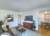 Thumbnail 7 of 13 - a living room with a couch and a coffee table