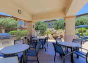 Thumbnail 23 of 23 - an outdoor patio with tables and chairs and a fountain
