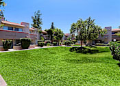 Thumbnail 76 of 94 - A grassy area in front of a building.