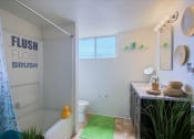Thumbnail 19 of 21 - a bathroom with a bathtub and a sink