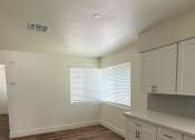 Thumbnail 6 of 8 - a photo of the kitchen and living room of a 560 square foot, 1 bedroom apartment at