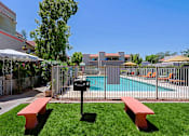 Thumbnail 70 of 94 - A pool area with a bench and a mailbox.