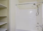 Thumbnail 6 of 15 - A white shower stall with a shower head and hand held shower.
