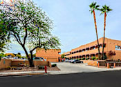 Thumbnail 9 of 15 - A building with a red fire hydrant in front of it.