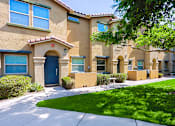 Thumbnail 21 of 29 - A row of houses with blue doors and windows.