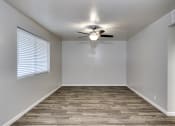Thumbnail 8 of 9 - an empty bedroom with a ceiling fan and a window