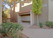 Thumbnail 14 of 15 - a garage with a tree in front of it