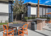 Thumbnail 10 of 10 - a patio with tables and chairs in front of a building