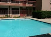 Thumbnail 3 of 5 - A small pool in front of a building at Ambassador West Apartments, Arizona