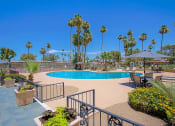 Thumbnail 3 of 21 - a resort style swimming pool with palm trees in the background