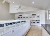 Thumbnail 6 of 17 - the laundry room has plenty of washes and dryers
