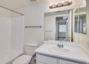 Thumbnail 15 of 17 - a bathroom with a sink toilet and a mirror