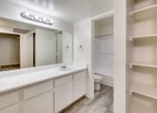 Thumbnail 9 of 17 - a bathroom with a sink and a mirror and a toilet