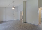 Thumbnail 23 of 24 - A room with a light hanging from the ceiling and a door on the right at Connect on Northern, Glendale, AZ 85301