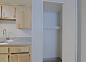 Thumbnail 21 of 24 - A kitchen with wooden cabinets and a white sink at Connect on Northern, Glendale, AZ 85301