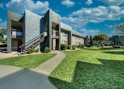Thumbnail 18 of 18 - A modern building with a green lawn in front. at Tela Verde Apartment Homes, Glendale, AZ, 85306