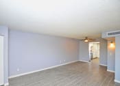 Thumbnail 4 of 9 - an empty living room with a ceiling fan