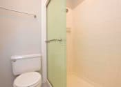 Thumbnail 9 of 9 - a bathroom with a toilet and a shower