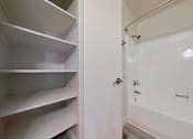 Thumbnail 13 of 16 - A white refrigerator with its door open.