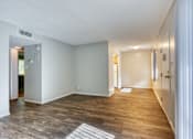 Thumbnail 9 of 14 - A room with wooden flooring and white walls. at The Link Apartments, Mesa, 85201