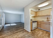 Thumbnail 7 of 14 - A kitchen with wooden floors and a refrigerator. at The Link Apartments, Mesa, 85201