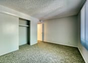 Thumbnail 11 of 14 - A room with a carpeted floor and two doors. at The Link Apartments, Arizona, 85201