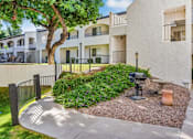 Thumbnail 11 of 12 - A courtyard with a mailbox and a bench at Tides on East Cactus Apartments, Phoenix, 85032