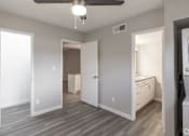Thumbnail 6 of 12 - A room with a ceiling fan and a washing machine at Tides on East Cactus Apartments, Phoenix, 85032