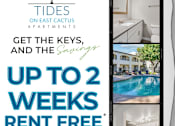 Thumbnail 1 of 12 - A poster advertises rent-free weeks at Tides on East Cactus Apartments.