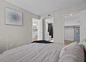 Thumbnail 7 of 28 - A bedroom with a large bed and a mirror on the wall  at Tides on McDowell, Phoenix, AZ