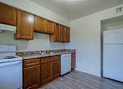 Thumbnail 11 of 27 - Kitchen with Cabinets at Sahuaro West Apartments, Phoenix, Arizona