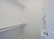 Thumbnail 5 of 32 - a small bathroom with white walls and a rail in the corner
