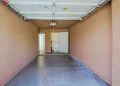 Thumbnail 48 of 94 - A long hallway with a white door at the end.