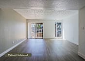 Thumbnail 16 of 51 - A room with platinum colored flooring and cottonwood colored walls.