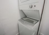 Thumbnail 13 of 32 - the laundry room has a washer and dryer and a sink