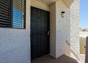 Thumbnail 38 of 51 - A black door with the number 141 on it is on a white wall.