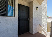 Thumbnail 25 of 94 - A black door with the number 14 on it is on a white wall.