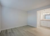 Thumbnail 20 of 32 - an empty bedroom with white walls and a bathroom