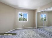 Thumbnail 29 of 51 - A room with a carpet floor, a window, and a sliding glass door.