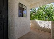 Thumbnail 10 of 94 - A white wall with a window and a door with a metal handle.