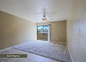Thumbnail 31 of 51 - A room with a carpet floor and a ceiling fan.