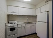 Thumbnail 9 of 30 - Kitchen with cabinets at The Link Apartments, Mesa, AZ, 85201