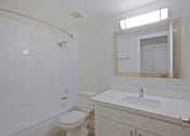 Thumbnail 7 of 19 - a bathroom with a sink toilet and bathtub